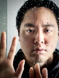 Close-up portrait of wet man