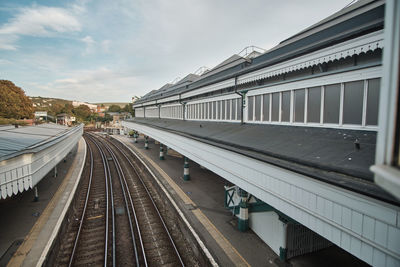 Train tracks running through lew railway station - high angle view