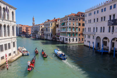 Venice, italy, 11. june 2022 gondola and boats on canal grande.
