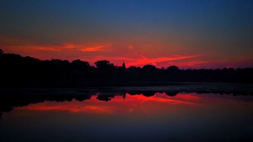 Scenic view of lake at sunset