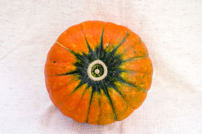 Close-up of pumpkin against orange background