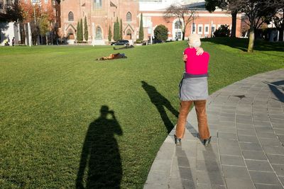 Woman standing on footpath