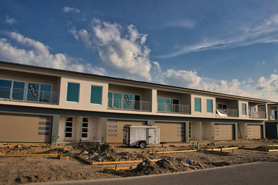 View of construction site against sky in city