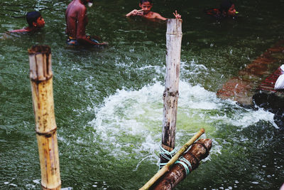 High angle view of men fishing in river
