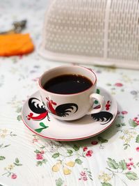 Black coffee in cup on table