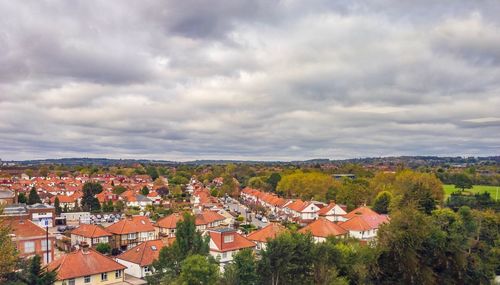 High angle view of townscape against cloudy sky