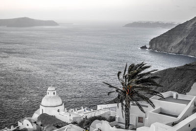 High angle view of sea and landscape against sky