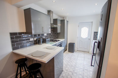 Empty chairs and tables in kitchen 