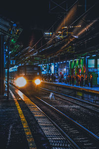 Train at railroad station at night