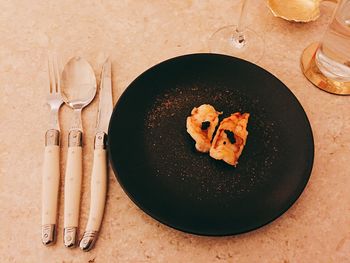 High angle view of meat in plate on table