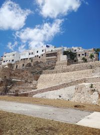 View of old building against cloudy sky