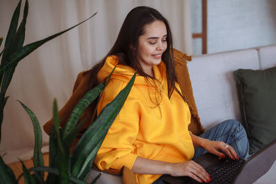 Young woman using laptop