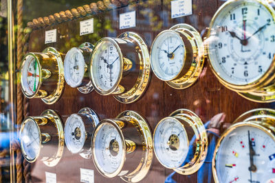 Close-up of clocks at store