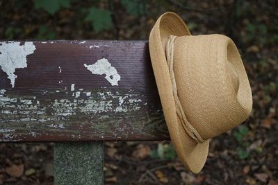 Close-up of hat on bench