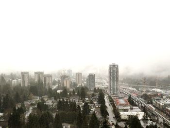 High angle view of buildings in city against sky