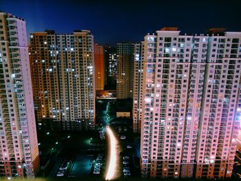 Aerial view of city lit up at night