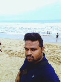 Portrait of young man on beach