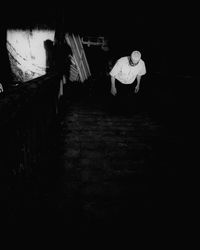 Rear view of woman walking on staircase