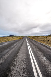 Road amidst landscape against sky