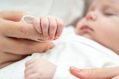 Cropped hand of doctor examining patient