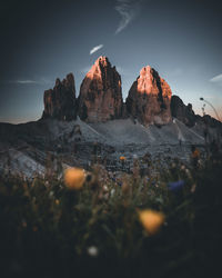 Rock formations on mountain against sky