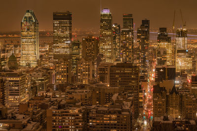 Illuminated city lit up at night