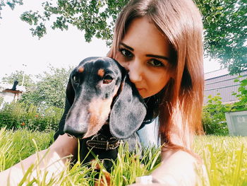 Portrait of young woman with dog