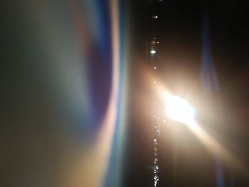 Close-up of sunlight streaming through illuminated water
