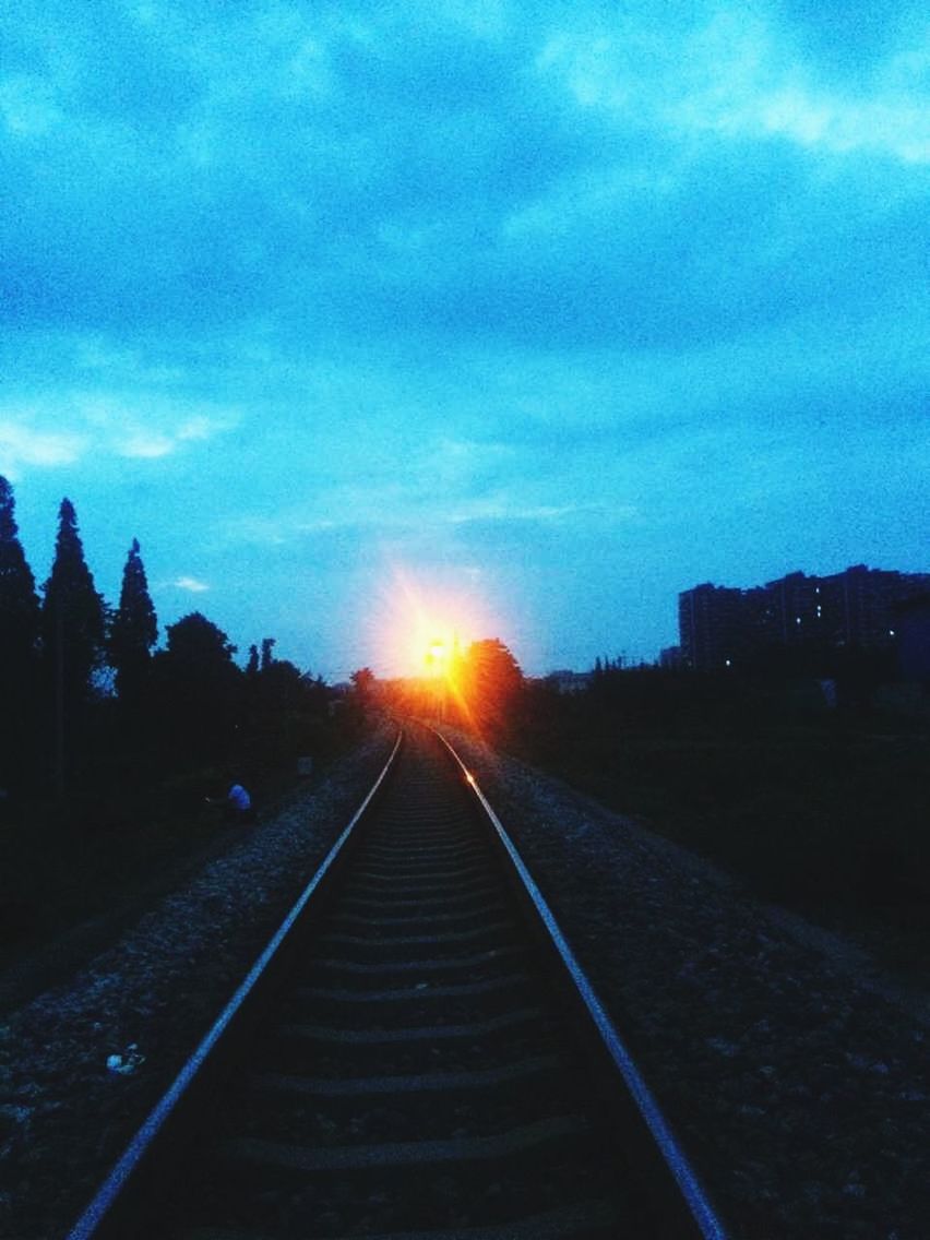 sunset, sky, the way forward, railroad track, cloud - sky, sun, transportation, vanishing point, silhouette, diminishing perspective, cloud, sunlight, sunbeam, lens flare, nature, tranquility, outdoors, built structure, tranquil scene, road