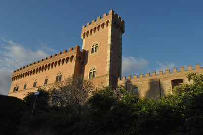 Low angle view of old building against sky