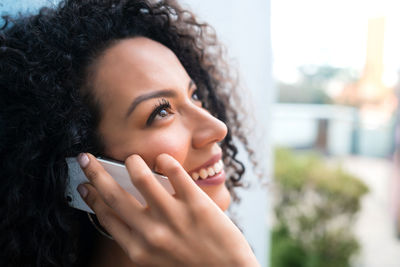 Close-up portrait of a smiling young woman