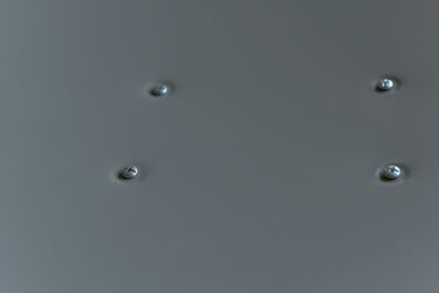 Full frame shot of water drops on paper