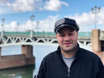 Portrait of smiling man against sky