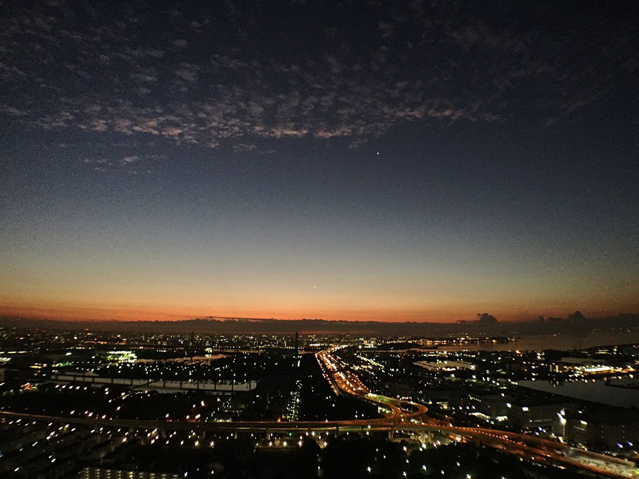 illuminated, night, cityscape, city, aerial view, high angle view, sky, built structure, architecture, building exterior, crowded, landscape, city life, dark, scenics, no people, road, light, outdoors, dusk