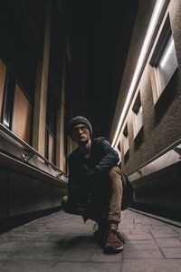 Portrait of young man standing on steps