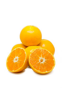 Close-up of oranges against white background