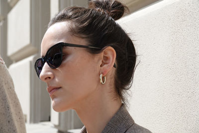 Close-up portrait of young woman looking away