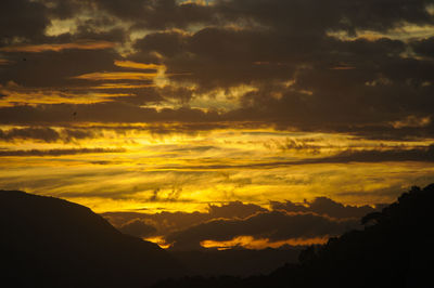 Scenic view of dramatic sky during sunset