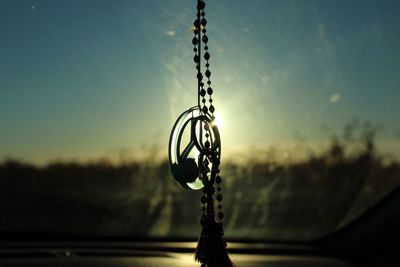 Close-up of chain against sky