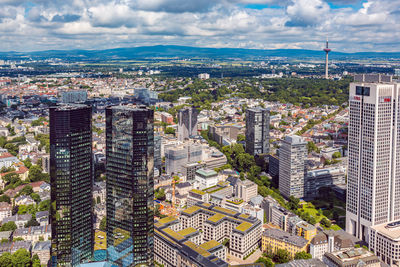 Aerial view of cityscape against sky