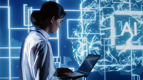 Digital composite image of man using laptop