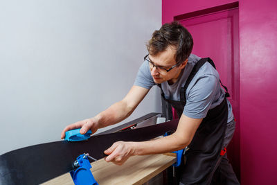 Side view of man working at home