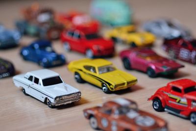 Close-up of various toy cars arranged on table