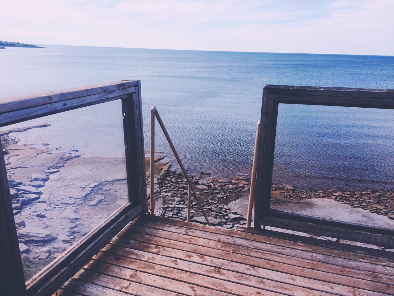 water, sea, railing, horizon over water, pier, sky, tranquil scene, tranquility, wood - material, scenics, nature, jetty, beauty in nature, rippled, ocean, no people, idyllic, day, wood, outdoors