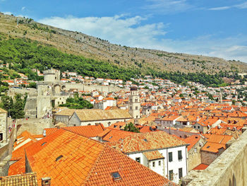 Houses in town against sky