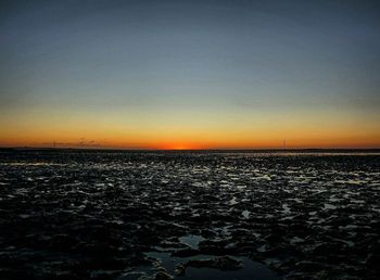 Scenic view of sea against dramatic sky