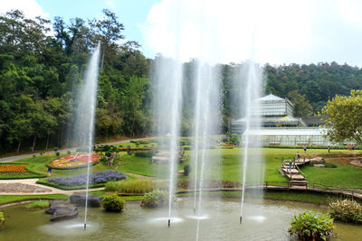 Scenic view of waterfall against sky