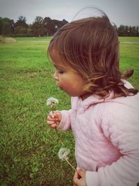 Girl standing on field