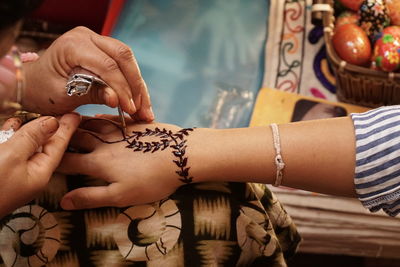 Close-up of woman hand with tattoo on hands