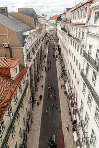 High angle view of people by buildings in town